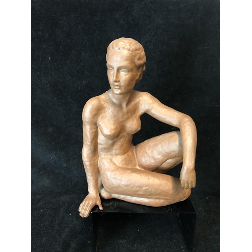 139 - An Art Deco style terracotta figure of a seated nude female, probably Austrian, impressed 12 to base... 