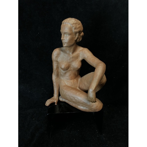 139 - An Art Deco style terracotta figure of a seated nude female, probably Austrian, impressed 12 to base... 