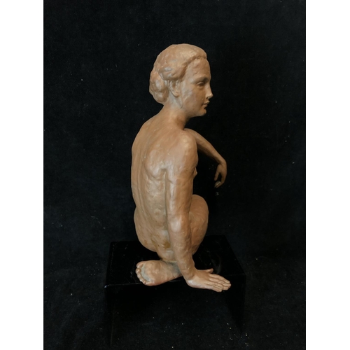 139 - An Art Deco style terracotta figure of a seated nude female, probably Austrian, impressed 12 to base... 