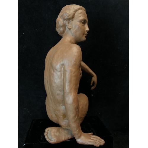 139 - An Art Deco style terracotta figure of a seated nude female, probably Austrian, impressed 12 to base... 