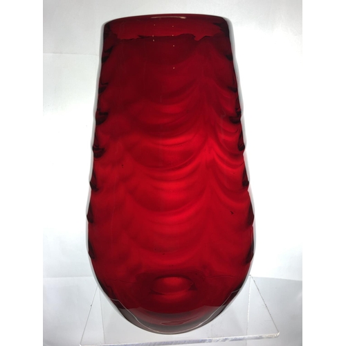 148 - A large Mid Century ruby glass vase, in the manner of Marriot Powell, Whitefriars, moulded with fest... 