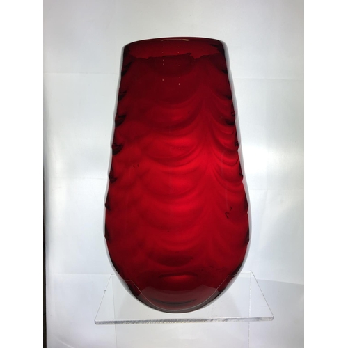 148 - A large Mid Century ruby glass vase, in the manner of Marriot Powell, Whitefriars, moulded with fest... 