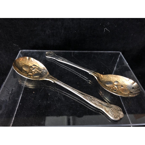 2 - Four silver golf trophy spoons, the handles formed as a pair of golf clubs with single ball finial, ... 