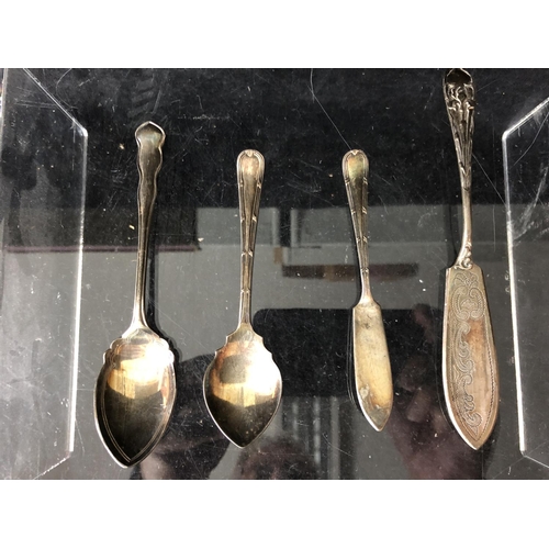 2 - Four silver golf trophy spoons, the handles formed as a pair of golf clubs with single ball finial, ... 