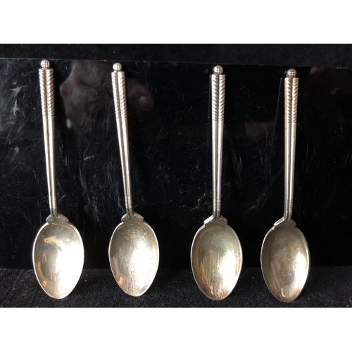 2 - Four silver golf trophy spoons, the handles formed as a pair of golf clubs with single ball finial, ... 