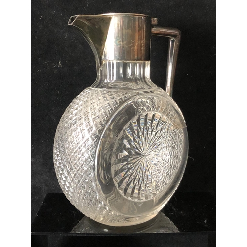 4 - A cut glass and silver plated Claret Jug, the body of circular form cut with sunbursts and strawberr... 