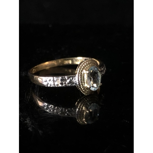 7 - Two dress rings - An oval aqua marine set in yellow gold with white metal shoulders, stamped 9K; and... 