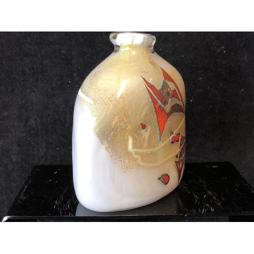 243 - Sam Herman - An elliptical arched top bottle vase, of gold grey body with iron red and white inclusi... 