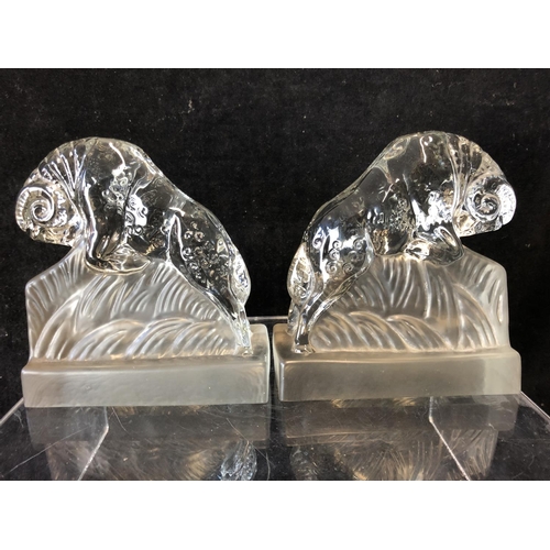 244 - A pair of Art Deco glass book ends modelled as charging rams, by the Libochovice glass company and a... 