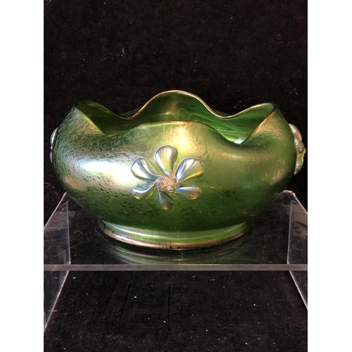 249 - A Loetz green papillon glass bowl, circular with crimped wavy upper rim, applied with iridescent blu... 