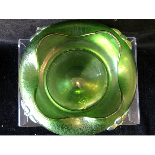 249 - A Loetz green papillon glass bowl, circular with crimped wavy upper rim, applied with iridescent blu... 