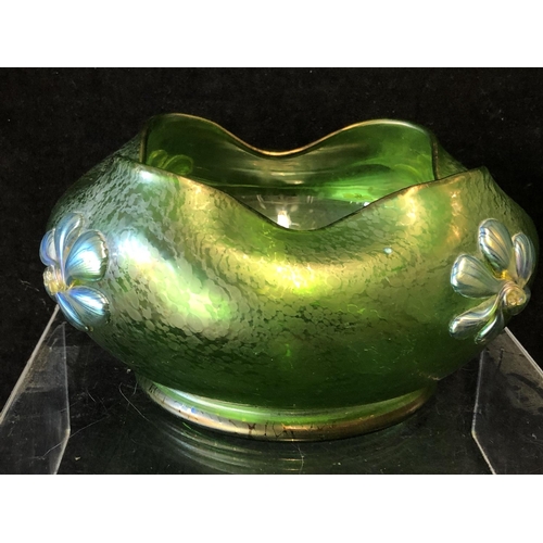 249 - A Loetz green papillon glass bowl, circular with crimped wavy upper rim, applied with iridescent blu... 