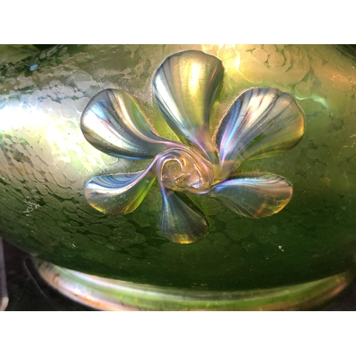 249 - A Loetz green papillon glass bowl, circular with crimped wavy upper rim, applied with iridescent blu... 