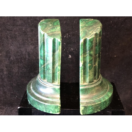 253 - A pair of green stained marble bookends, in the form of truncated columns, 14.5cm (2)