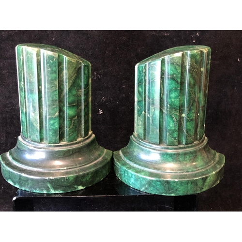 253 - A pair of green stained marble bookends, in the form of truncated columns, 14.5cm (2)