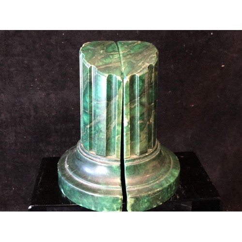 253 - A pair of green stained marble bookends, in the form of truncated columns, 14.5cm (2)