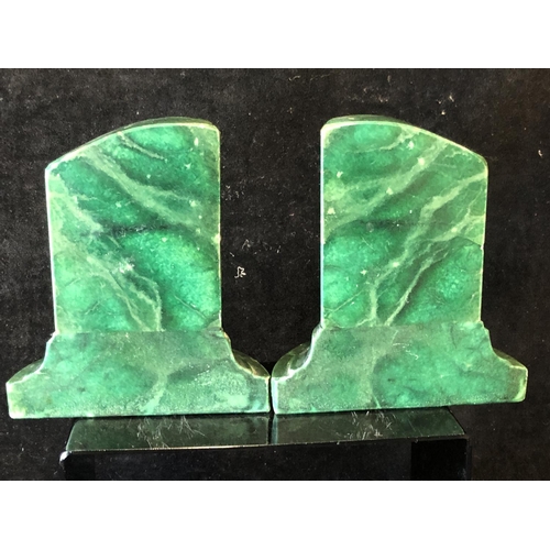 253 - A pair of green stained marble bookends, in the form of truncated columns, 14.5cm (2)