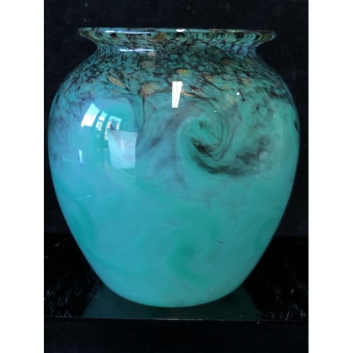 256 - A Monart glass vase, of ovoid form with everted rim, the jade green ground coloured with black and g... 