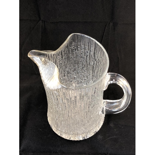 8 - Tapio Wirkkala for Iittala, Finland - an Ultima Thule pattern jug, colourless glass, 20cm high