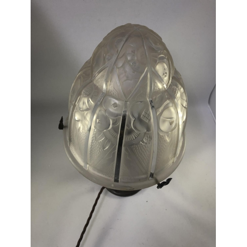 38 - Lighting - a table lamp - the Art Deco jelly mould form glass lampshade, decorated with stylised flo... 