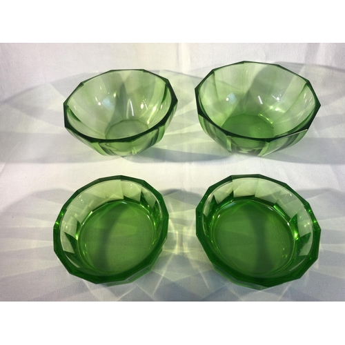 110 - Continental Glass- probably Moser, four emerald green facet cut bowls, comprising a pair of deep bow... 