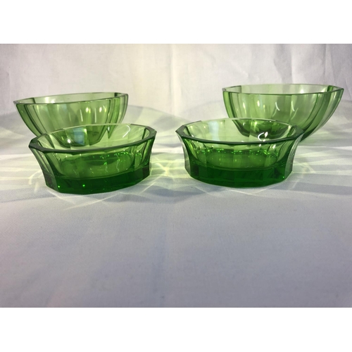 110 - Continental Glass- probably Moser, four emerald green facet cut bowls, comprising a pair of deep bow... 