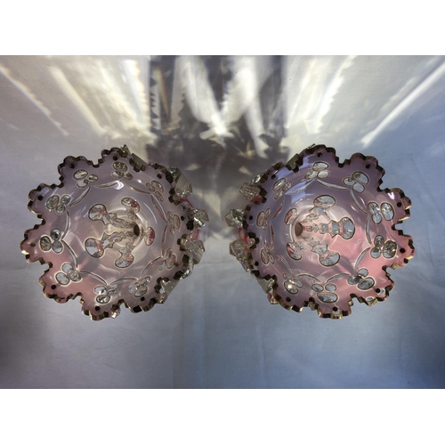 102 - Bohemian Glass - a pair of double overlay glass table lustres, of deep rose pink over white on colou... 