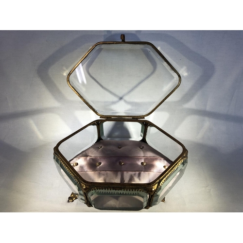 106 - French Glass - A gilt metal mounted glass jewellery box or casket, of hexagonal shape, on four volut... 