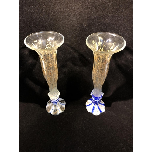 105 - Bohemian Glass - A pair of soli fleur bud vases, the colourless trumpet flutes gilded and enamelled ... 