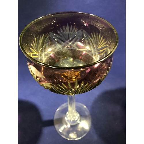 63 - Continental Glass - Two two colour overlay hock glasses, the bowls of green; and amethyst over yello... 