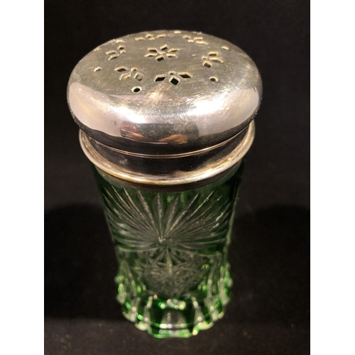 64 - Continental glass - a green overlay glass sugar caster, cylindrical with spreading foot, cut through... 