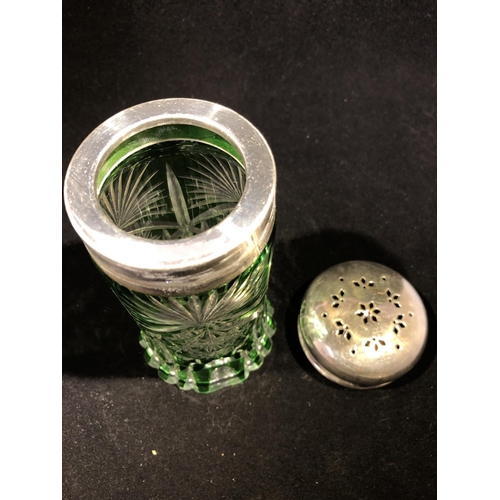 64 - Continental glass - a green overlay glass sugar caster, cylindrical with spreading foot, cut through... 