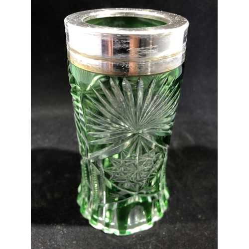 64 - Continental glass - a green overlay glass sugar caster, cylindrical with spreading foot, cut through... 