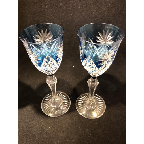 61 - Saint Louis - a pair of blue overlay wine glasses, the bowls cut through to colourless with diamond ... 