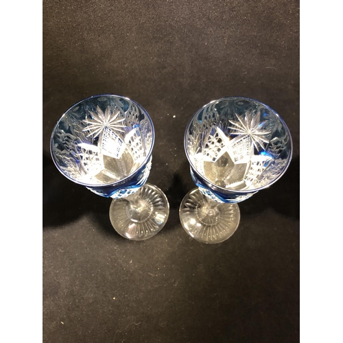 61 - Saint Louis - a pair of blue overlay wine glasses, the bowls cut through to colourless with diamond ... 