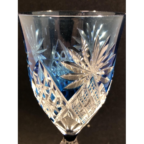 61 - Saint Louis - a pair of blue overlay wine glasses, the bowls cut through to colourless with diamond ... 