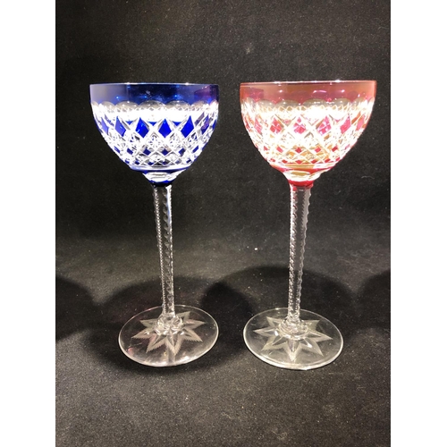 62 - Saint Louis - a pair of wine glasses, the bowls of overlay cobalt blue; and ruby, finely cut with al... 