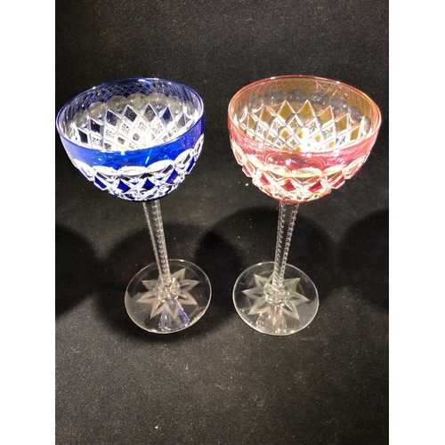 62 - Saint Louis - a pair of wine glasses, the bowls of overlay cobalt blue; and ruby, finely cut with al... 