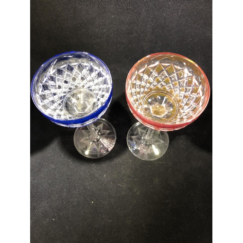 62 - Saint Louis - a pair of wine glasses, the bowls of overlay cobalt blue; and ruby, finely cut with al... 