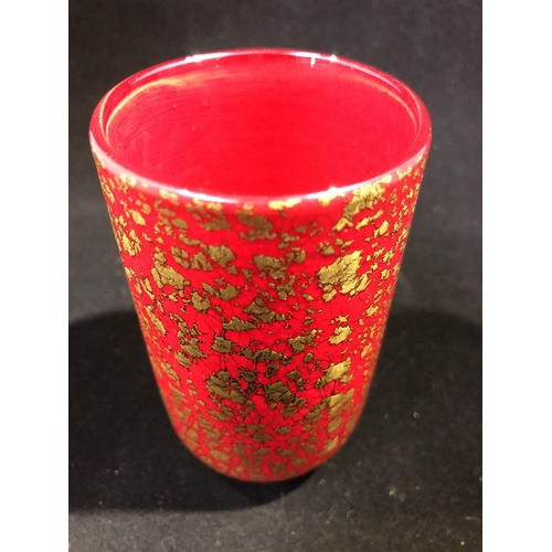 23 - Timothy Harris for Isle of Wight Glass - a firecracker pattern cylindrical vase, of gold fleck on br... 