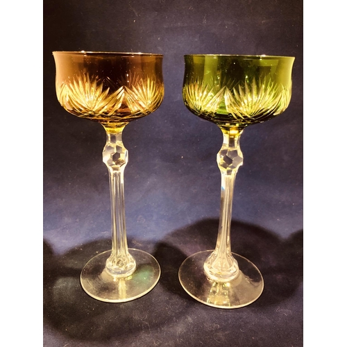 63 - Continental Glass - Two two colour overlay hock glasses, the bowls of green; and amethyst over yello... 