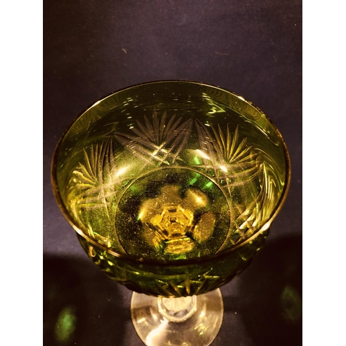 63 - Continental Glass - Two two colour overlay hock glasses, the bowls of green; and amethyst over yello... 