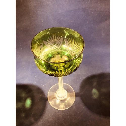 63 - Continental Glass - Two two colour overlay hock glasses, the bowls of green; and amethyst over yello... 