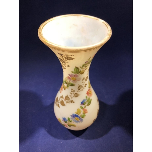 68 - Baccarat - a white opaline glass vase, gilded with vines and enamelled with floral swags, 20cm high