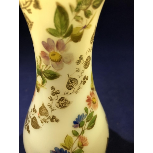 68 - Baccarat - a white opaline glass vase, gilded with vines and enamelled with floral swags, 20cm high