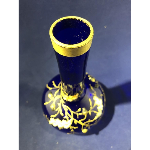 117 - Moser - a cobalt blue bottle vase, enamelled and gilded with oak leaves and branches with applied si... 