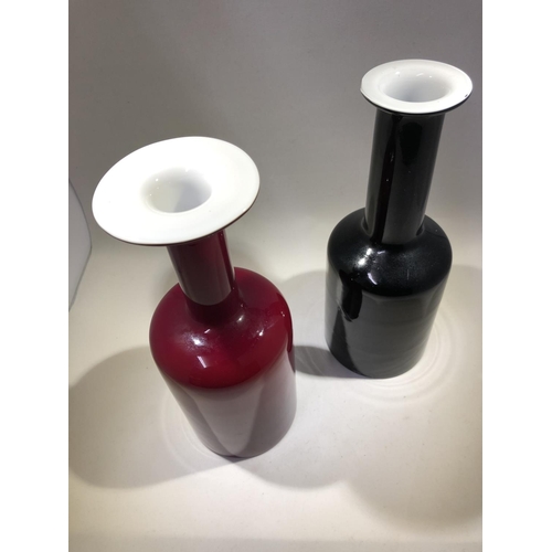 17 - Holmegaard - Two Gulvvase glass bottle vases, one of cherry red over white with wide flared upper ri... 