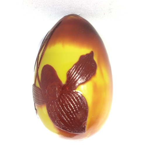 81 - Daum - a rare cameo glass egg form hand cooler, the cherry red cameo cut through to lemon yellow wit... 