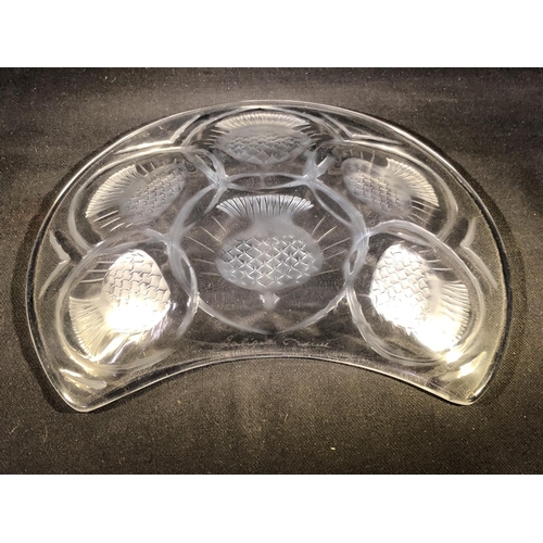 27 - Lalique - Chardon, a frosted and colourless glass crescent shape dish, decorated thistle designs, ha... 