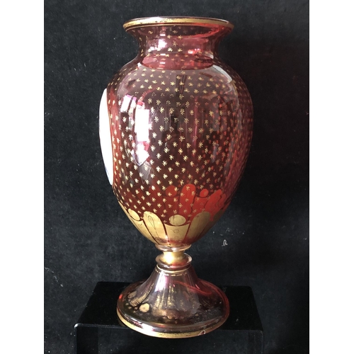 139 - Bohemian Glass - an overlay glass vase, the ovoid body of ruby overlaid in white and cut through wit... 